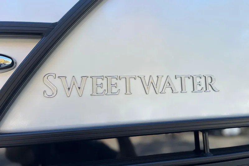 Slide: The Image of 2026 Godfrey SWEETWATER 2286 SFL logo on boat exterior. - 4