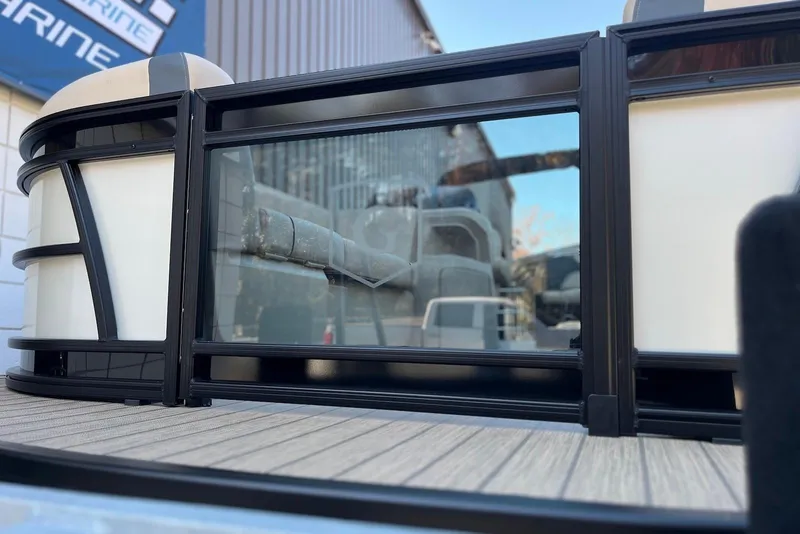 Slide: The Image of 2026 Godfrey SWEETWATER 2286 SFL pontoon boat with sleek black railing design. - 6