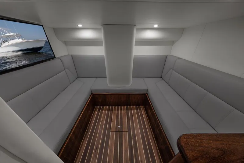 Slide: The Image of Interior of 2026 Albemarle 45 Carolinian yacht with sleek seating and wood flooring. - 10