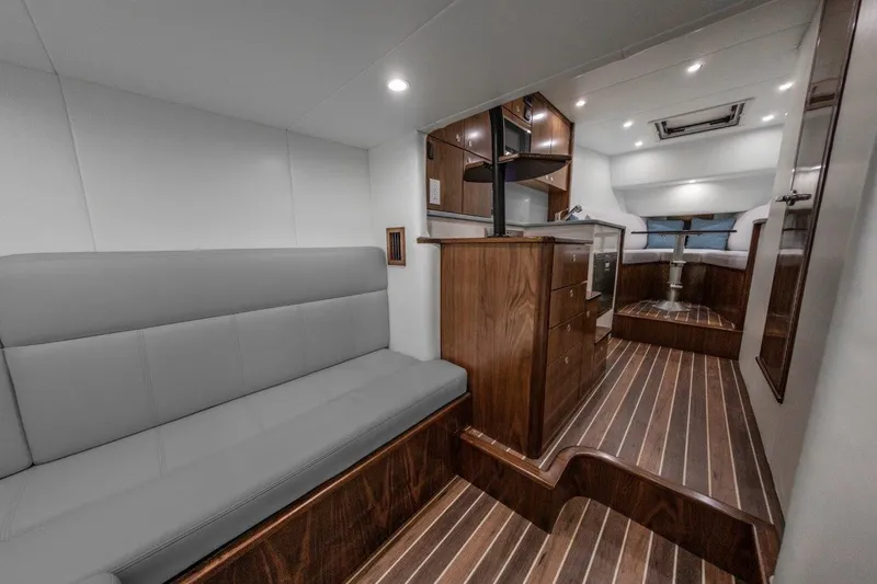 Slide: The Image of Interior of 2026 Albemarle 45 Carolinian yacht with modern seating and wood finishes. - 12