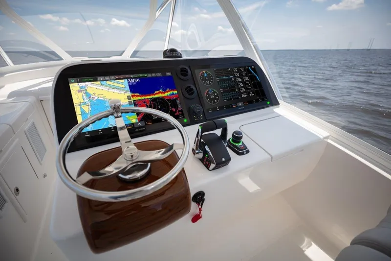 Slide: The Image of 2026 Albemarle 45 Carolinian helm with advanced navigation displays and controls. - 15