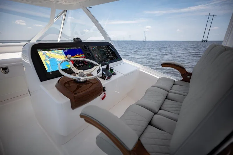 Slide: The Image of 2026 Albemarle 45 Carolinian helm with advanced navigation system and luxurious seating. - 19