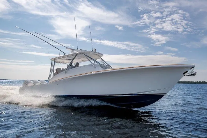 Slide: The Image of 2026 Albemarle 45 Carolinian boat cruising on open water under a clear sky. - 4