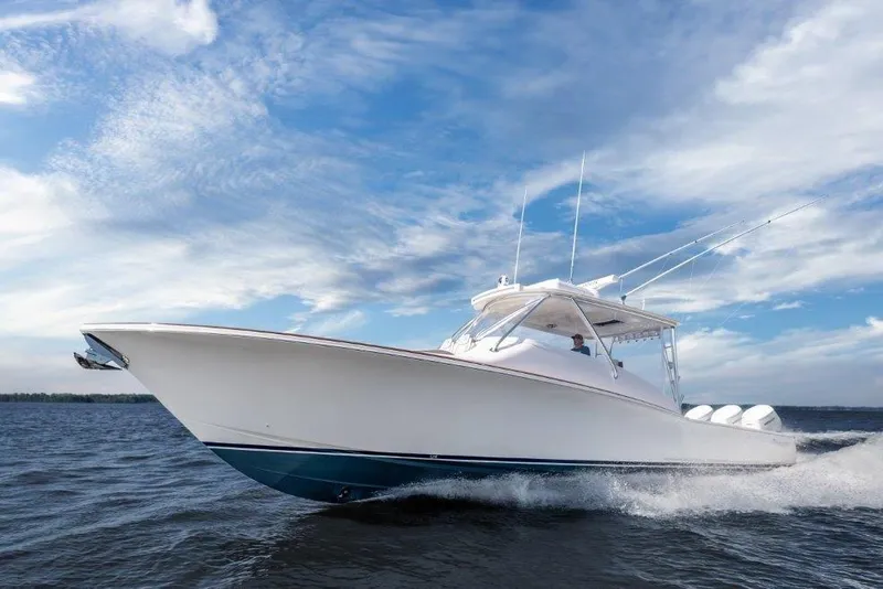 Slide: The Image of 2026 Albemarle 45 Carolinian boat cruising on open water under a blue sky. - 6