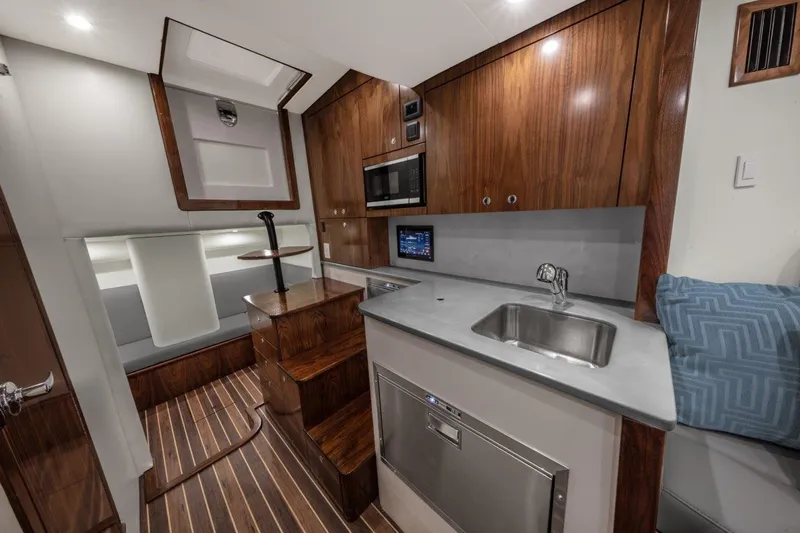 Slide: The Image of Luxurious interior of 2026 Albemarle 45 Carolinian yacht with modern kitchen and seating area. - 8