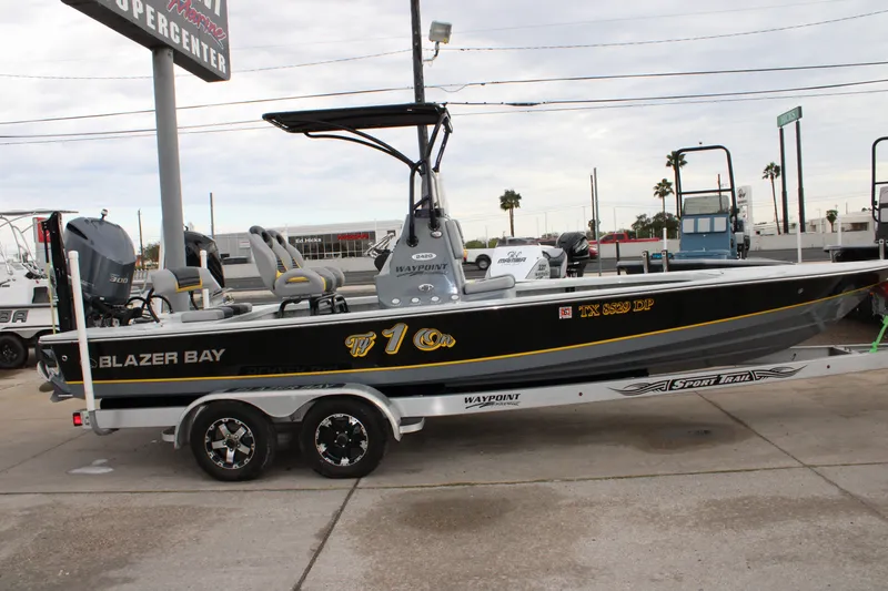 Slide: The Image of 2017 Blazer 2420 boat on trailer at a marine supercenter. - 1