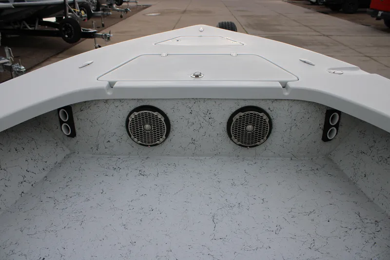 Slide: The Image of 2017 Blazer 2420 boat interior with speakers and storage compartments. - 19