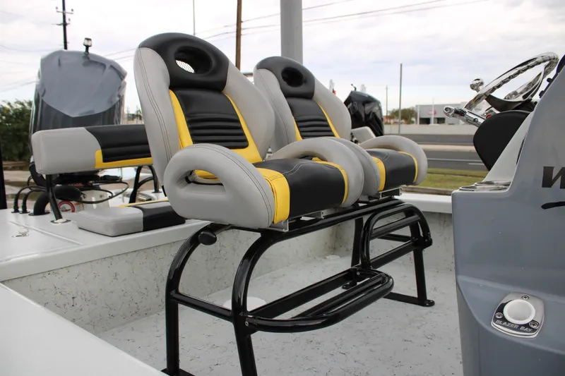 Slide: The Image of 2017 Blazer 2420 boat seats with black, gray, and yellow design. - 8