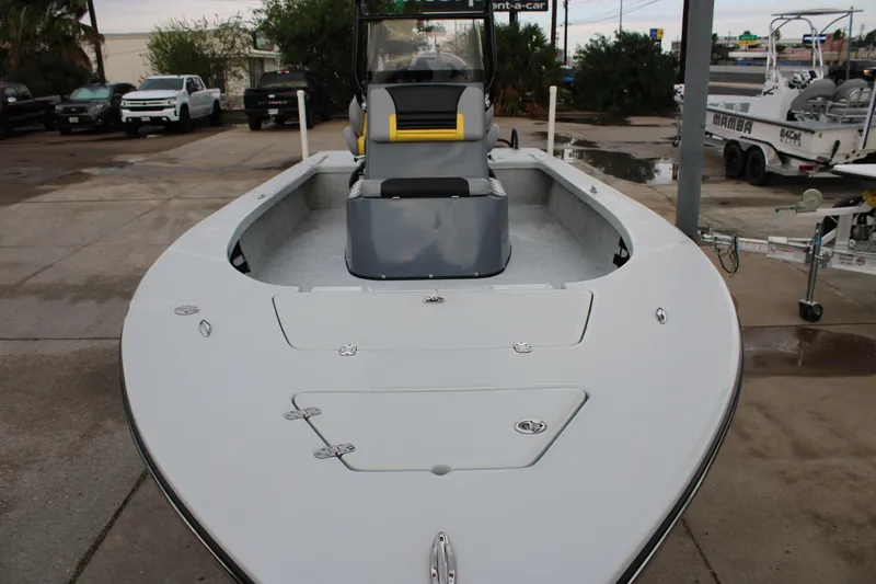Slide: The Image of 2017 Blazer 2420 boat, sleek design, parked outdoors, showcasing spacious deck and seating. - 6