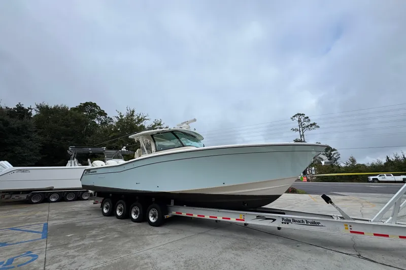 Slide: The Image of 2024 Grady-White Canyon 386 boat on trailer, parked outdoors. - 10