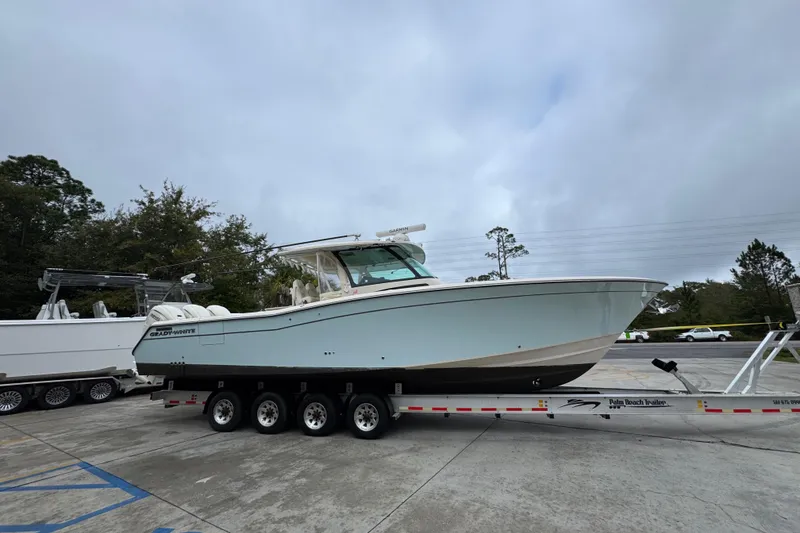 Slide: The Image of 2024 Grady-White Canyon 386 boat on trailer, parked outdoors. - 11