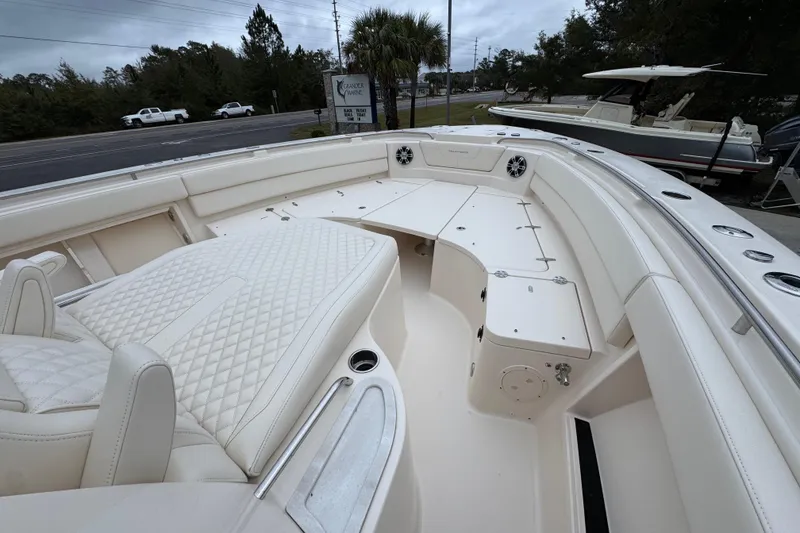Slide: The Image of 2024 Grady-White Canyon 386 boat interior with luxurious seating and storage compartments. - 21