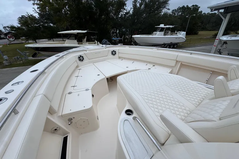 Slide: The Image of 2024 Grady-White Canyon 386 boat interior with luxurious seating and spacious deck. - 23