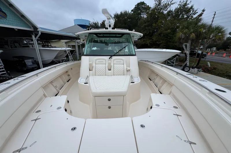 Slide: The Image of 2024 Grady-White Canyon 386 boat interior with seating and storage compartments. - 25