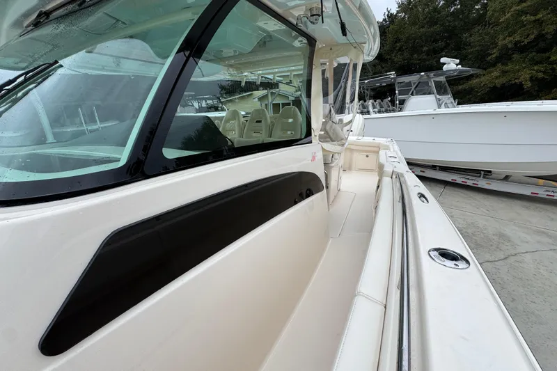 Slide: The Image of 2024 Grady-White Canyon 386 boat, showcasing sleek design and spacious deck area. - 26