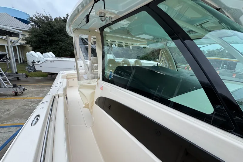 Slide: The Image of 2024 Grady-White Canyon 386 boat exterior with sleek design and spacious deck. - 27