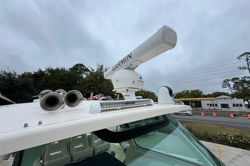 Slide: The Image of 2024 Grady-White Canyon 386 boat with Garmin radar and horn on the roof. - 28