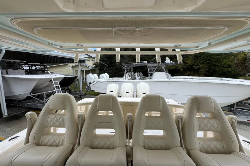 Slide: The Image of 2024 Grady-White Canyon 386 boat interior with luxurious seating and helm view. - 32