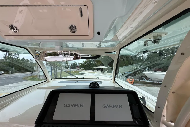 Slide: The Image of 2024 Grady-White Canyon 386 boat interior with Garmin navigation system. - 36