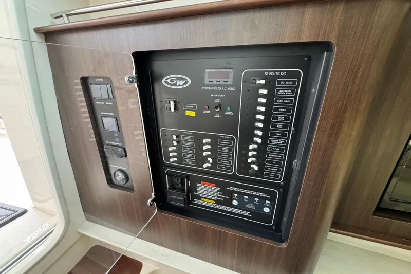 Slide: The Image of 2024 Grady-White Canyon 386 electrical control panel with switches and indicators. - 42