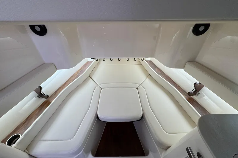 Slide: The Image of 2024 Grady-White Canyon 386 interior with white seating and wood accents. - 47