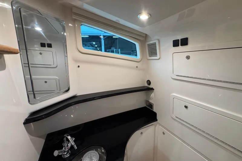 Slide: The Image of 2024 Grady-White Canyon 386 interior cabin with sleek design and modern amenities. - 53