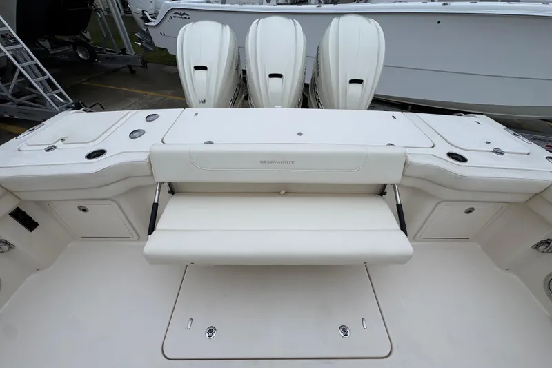 Slide: The Image of 2024 Grady-White Canyon 386 boat with triple engines and spacious seating. - 61