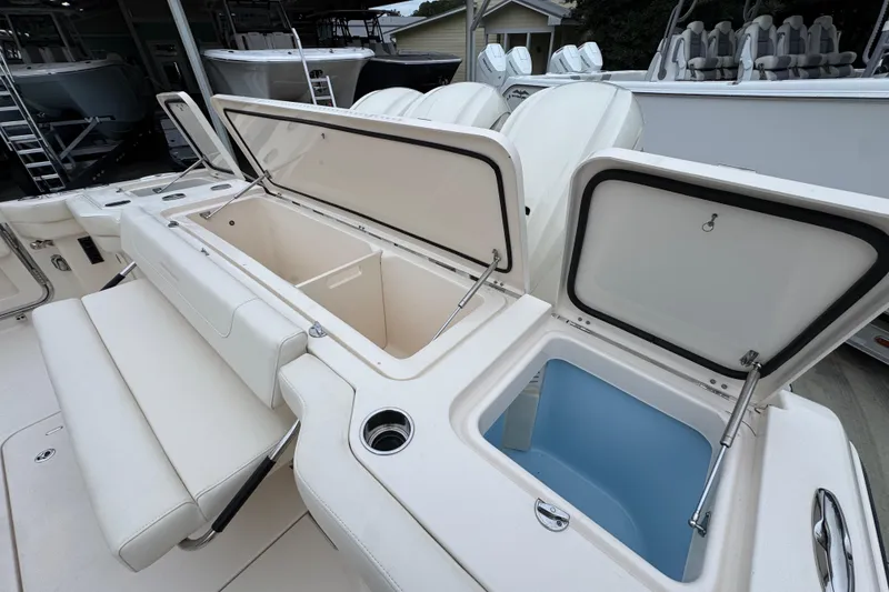 Slide: The Image of 2024 Grady-White Canyon 386 boat with open storage compartments and seating. - 64