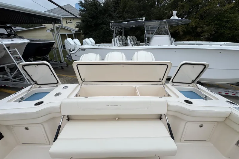 Slide: The Image of 2024 Grady-White Canyon 386 boat with open storage compartments and seating area. - 66