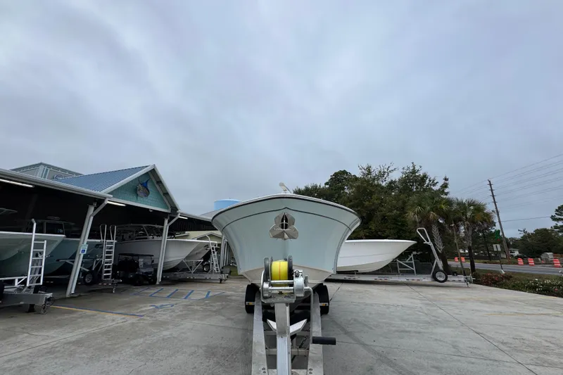 Slide: The Image of 2024 Grady-White Canyon 386 boat on trailer at dealership, overcast sky. - 7