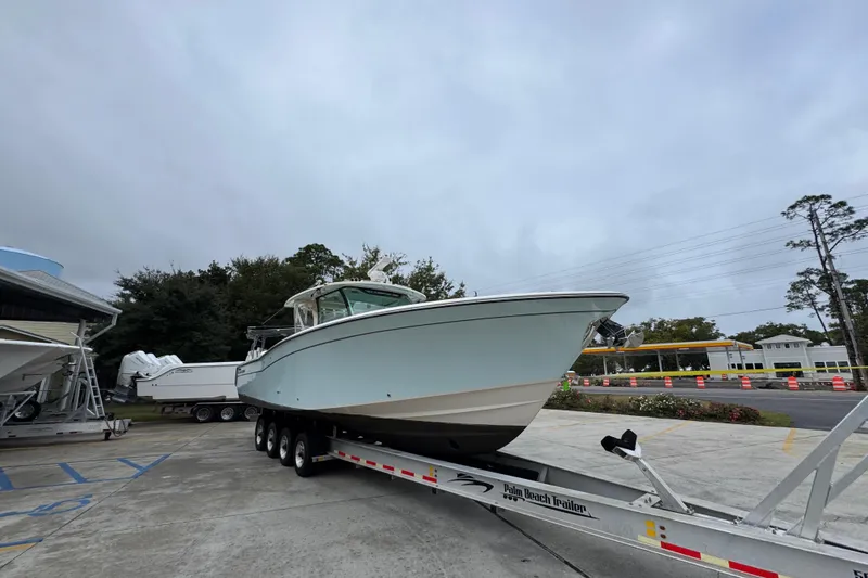 Slide: The Image of 2024 Grady-White Canyon 386 boat on trailer, parked outdoors. - 9