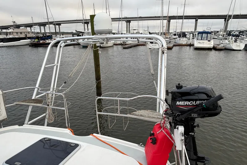 Slide: The Image of Hunter Passage 450 sailboat, 2000 model, docked with Mercury outboard motor. - 12