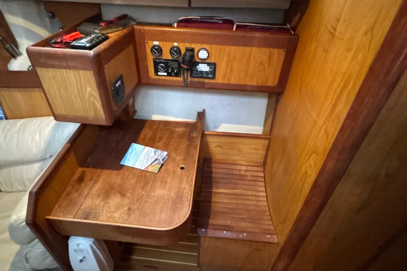 Slide: The Image of Interior of 2000 Hunter Passage 450 sailboat with wooden navigation station. - 24