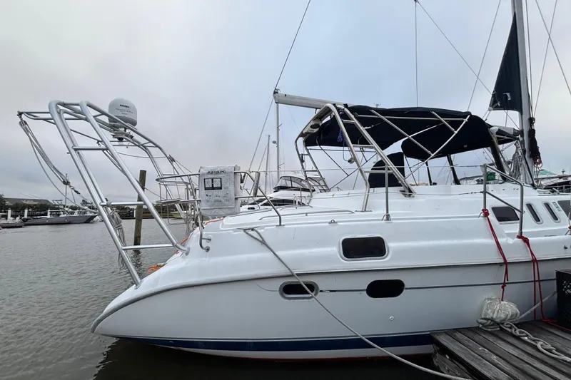 Slide: The Image of 2000 Hunter Passage 450 sailboat docked at marina, featuring sleek design and modern equipment. - 4