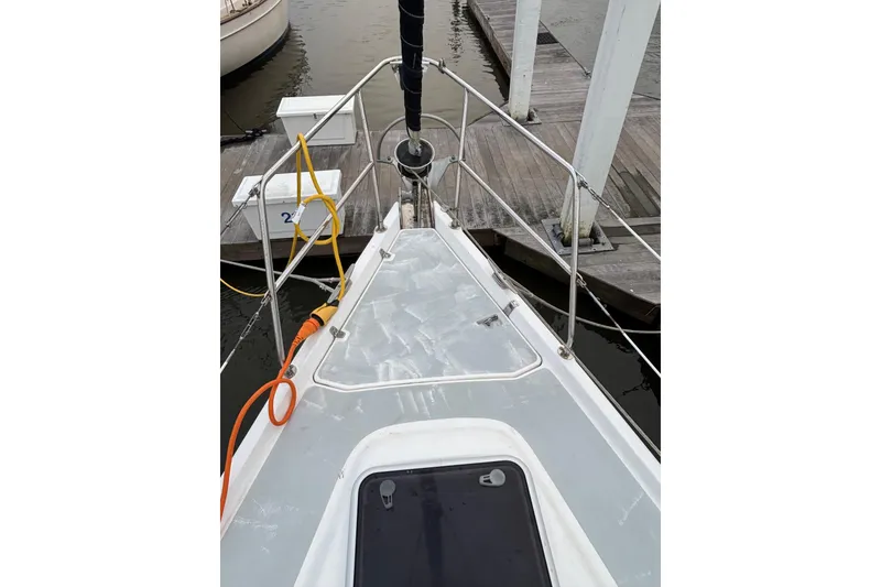 Slide: The Image of Bow view of 2000 Hunter Passage 450 sailboat docked at marina. - 6