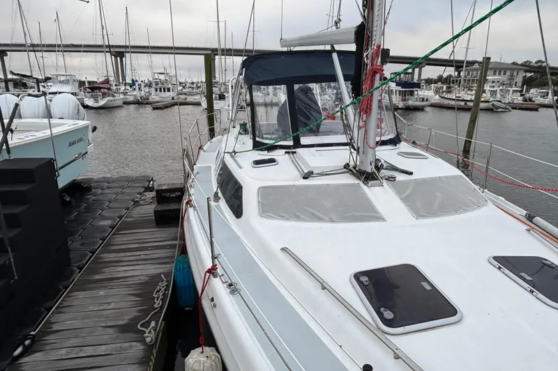 Slide: The Image of Hunter Passage 450 sailboat docked at marina, 2000 model, with overcast sky. - 8