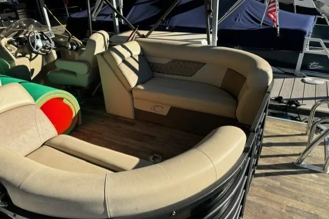 Slide: The Image of 2019 Crest 220 CREST II pontoon boat with beige seating and wooden deck. - 11