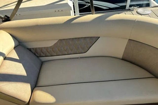 Slide: The Image of 2019 Crest 220 CREST II boat interior seating with beige upholstery and quilted design. - 14
