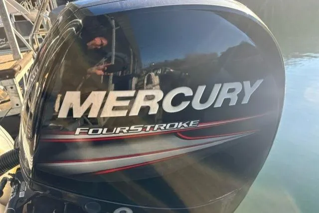Slide: The Image of Mercury FourStroke engine on 2019 Crest 220 CREST II boat, reflecting sunlight. - 20