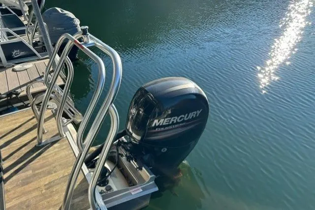 Slide: The Image of 2019 Crest 220 CREST II boat with Mercury outboard motor docked on calm water. - 21