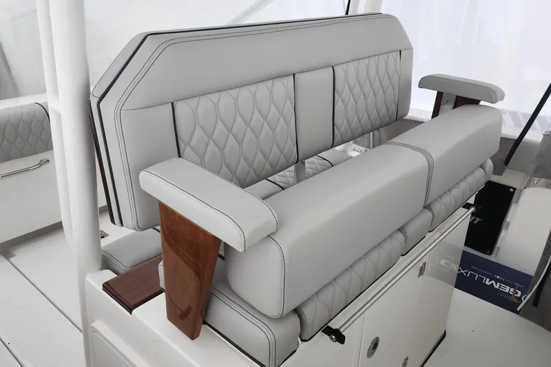 Slide: The Image of 2026 Pursuit S 288 Sport boat storage compartment with open hatch and stainless steel hardware. - 12