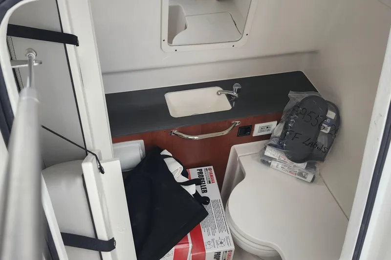 Slide: The Image of 2026 Pursuit S 288 Sport boat interior with gray cushioned seating. - 16