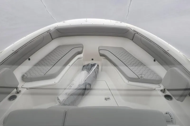 Slide: The Image of 2026 Pursuit S 288 Sport boat interior with sink and storage area. - 18