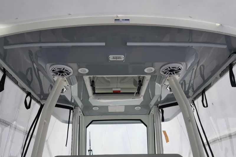 Slide: The Image of Interior of 2026 Pursuit S 288 Sport boat with compact bathroom amenities. - 19