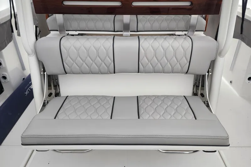 Slide: The Image of 2026 Pursuit S 288 Sport boat door with chrome handle and latch. - 8