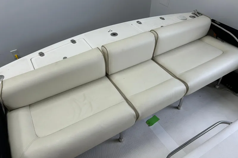 Slide: The Image of 2007 Hunt Yachts Harrier 25 boat interior with white cushioned seating. - 21