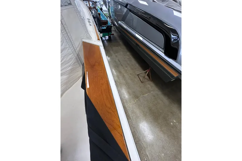 Slide: The Image of 2007 Hunt Yachts Harrier 25, sleek design with polished wood and metallic finish. - 5