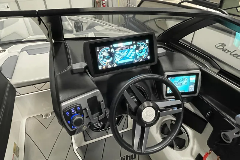 Slide: The Image of 2019 Malibu Wakesetter 25 LSV dashboard with advanced digital controls and steering wheel. - 11