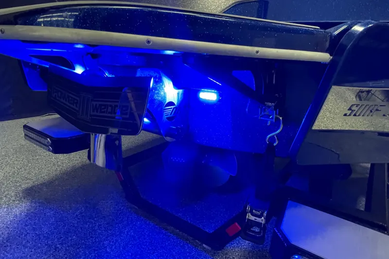 Slide: The Image of 2019 Malibu Wakesetter 25 LSV boat with illuminated blue underwater lights. - 12