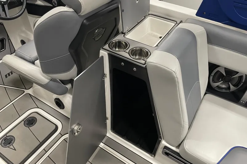 Slide: The Image of 2019 Malibu Wakesetter 25 LSV interior with open storage, cup holders, and seating. - 13